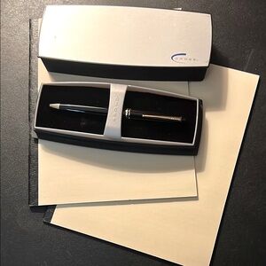 Cross Black and Gold Pen with Silver Box includes two notebooks.